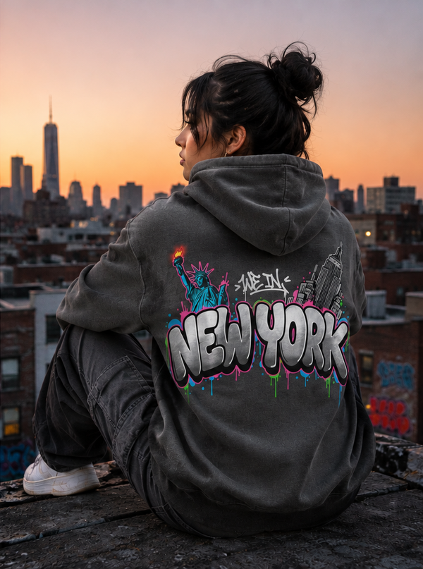 Grey We In New York hoodie with Statue of Liberty and Empire State Building graphic